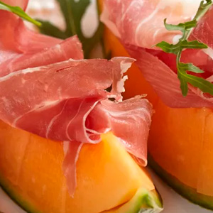 Cured ham with melon