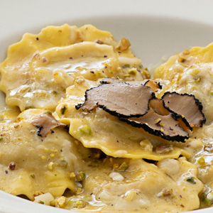 Duck ravioli with black truffle, pistachios, and pecorino